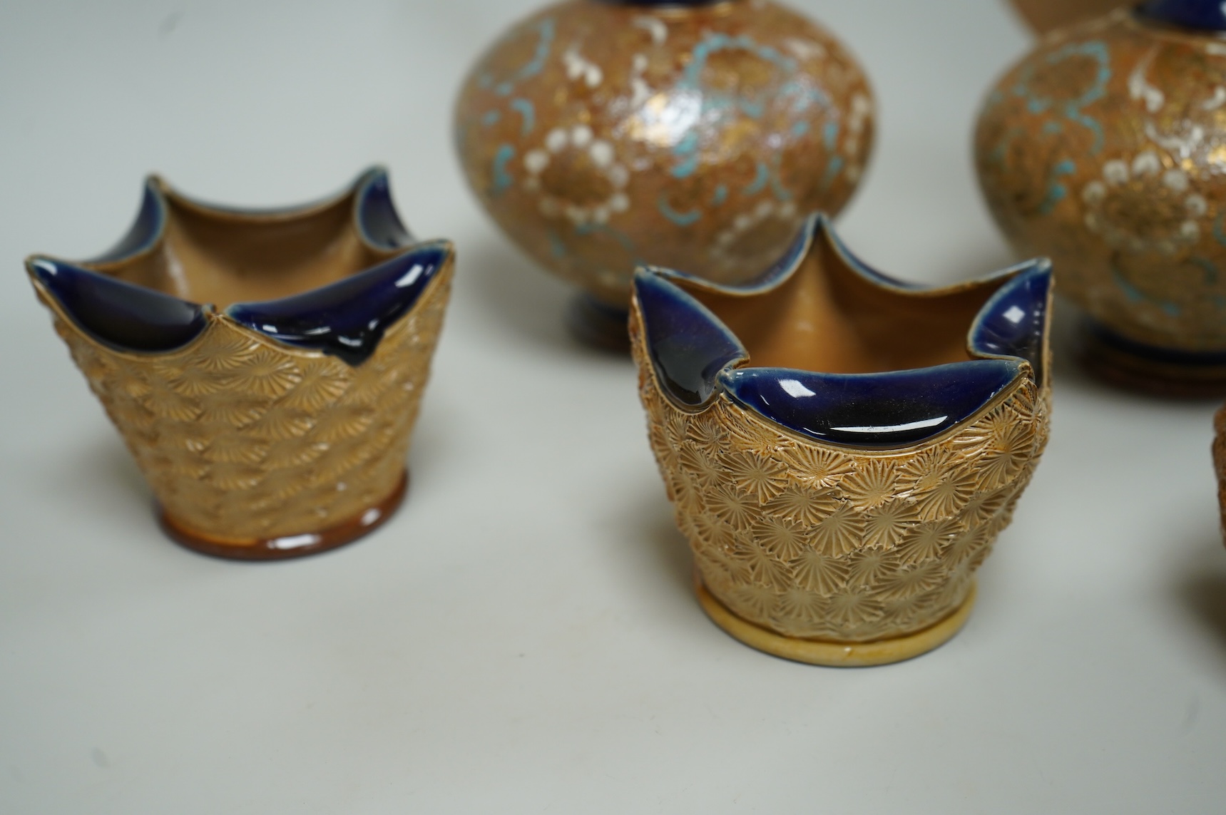 A pair of Royal Doulton Slater’s patent vases, 26cm high and pots and a jug together with a collection of miniature stoneware pots jugs and a pair of peppers